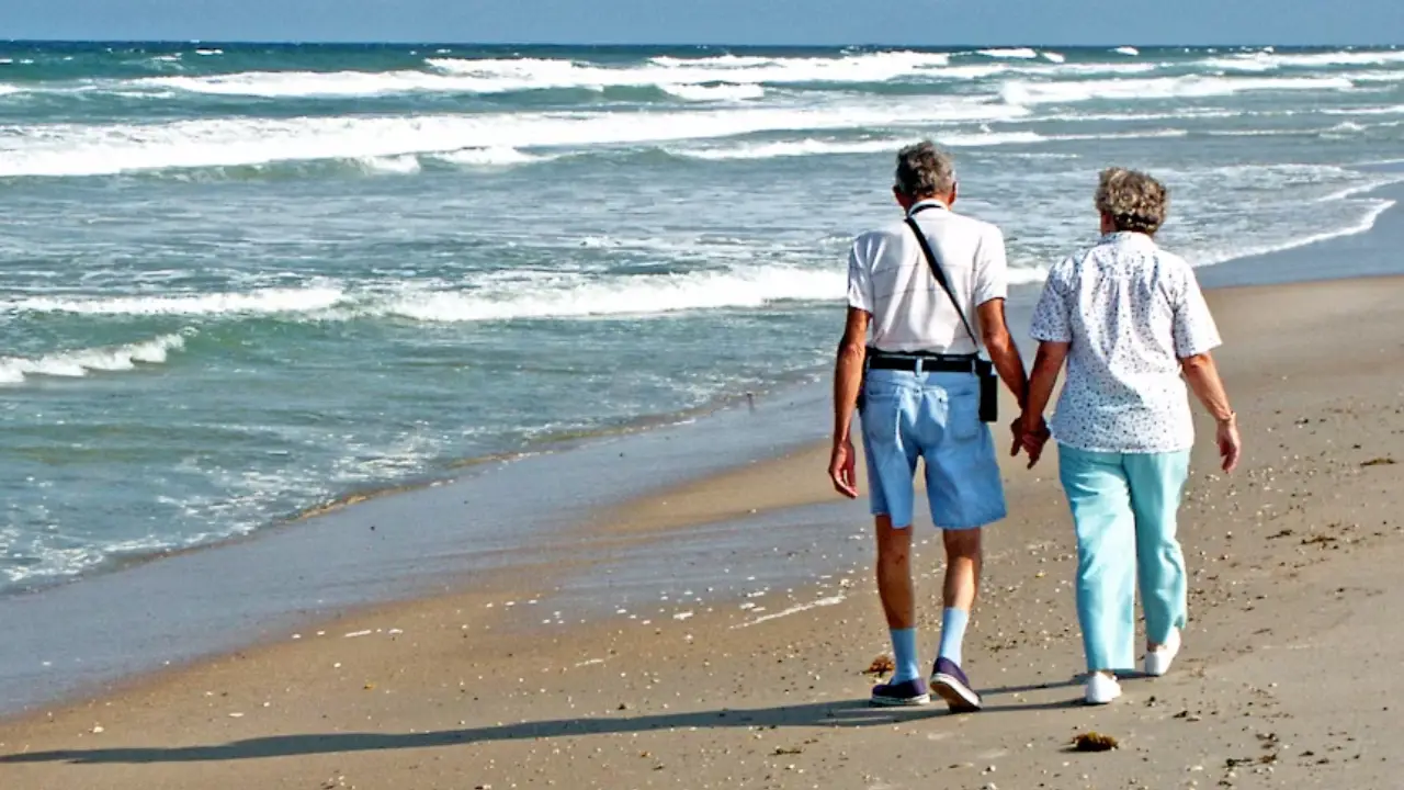 Senior couple reviewing life insurance policy documents together